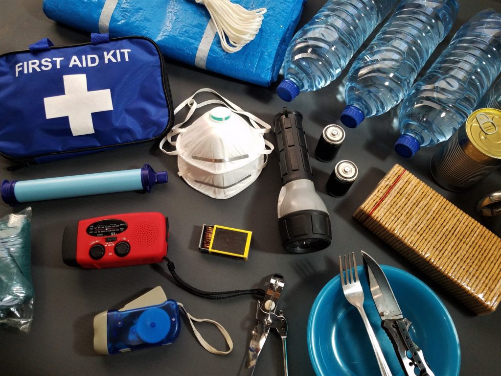 Moving house survival kit flat lay, showing suggested items